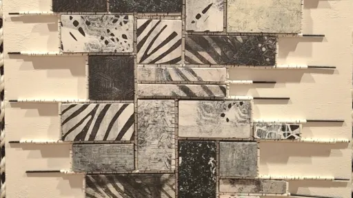 Diverse monochromatic patterned tiles made with acrylic and wood and paper straws