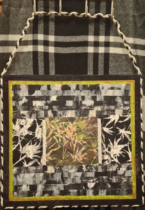 Textile art prints on rice paper showing abstract patterns, and a central artwork of golden wheat.